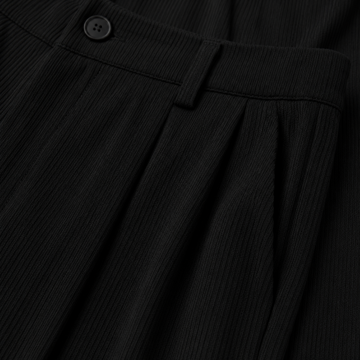 Ambrose Pleated Relaxed Trousers — waistband and pleat detail