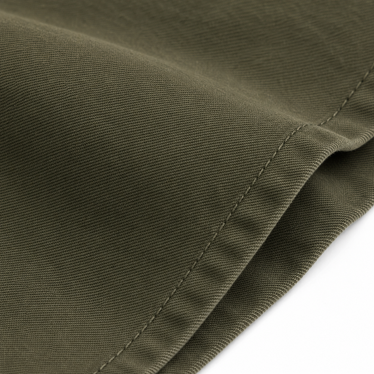 Close-up of structured army-green cotton twill and tonal stitching